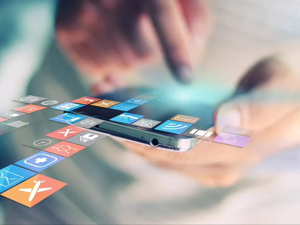 A smartphone surrounded by social media icons and online posts